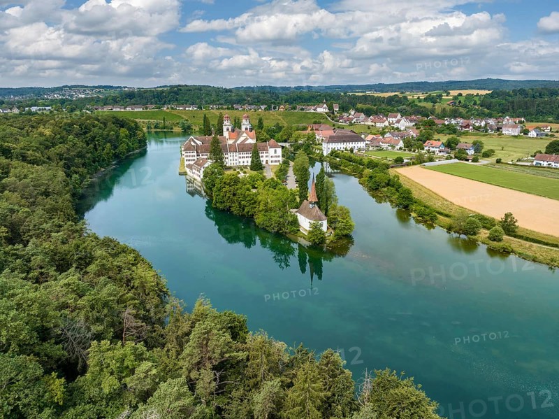 Aerial view of the former Benedictine abbey with the monastery church of St. Mary and the pointed church of St. Magdalena on the Rhine island of Rheinau, Andelfingen, Canton Zurich, Switzerland, Europe