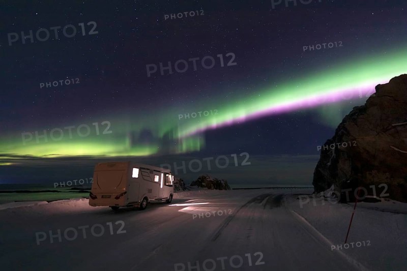 Motorhome and Northern Lights (Aurora borealis) in winter, Andoya, Vesteralen, Norway, Europe