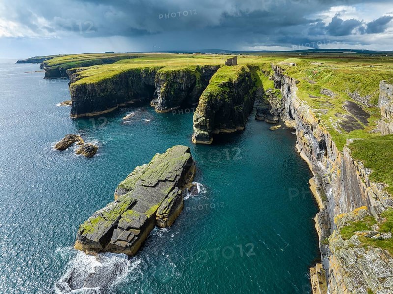 Aerial view of the ruined Castle of Old Wick surrounded by rugged cliffs on the North Sea coast, Wick, County Caithness, Scotland, United Kingdom, Europe