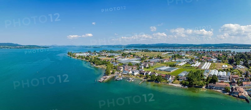 Aerial panorama of the western part of the island of Reichenau with the landing stage, on the horizon the Hegauberge, the peninsula Mettnau and the Bodanrück, district Konstanz, Baden-Württemberg, Germany, Europe