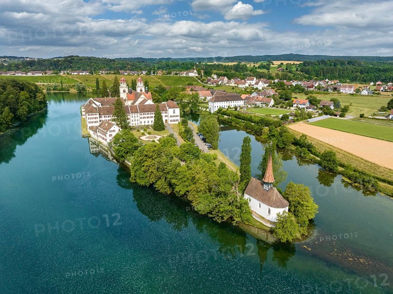 Aerial view of the former Benedictine abbey with the monastery church of St. Mary and the pointed church of St. Magdalena on the Rhine island of Rheinau, Andelfingen, Canton Zurich, Switzerland, Europe