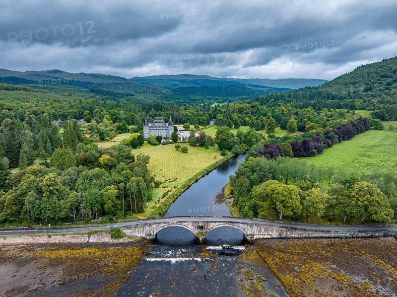 Aerial view of Inveraray Castle with the River Aray, and the A83 crossing the Array Bridge, Argyll and Bute, Scotland, United Kingdom, Europe