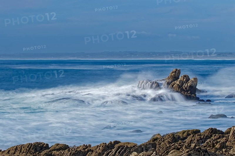 The waves of the Atlantic wash over the rocks on the coast off Penmarch in Brittany. Finistere, France, Europe