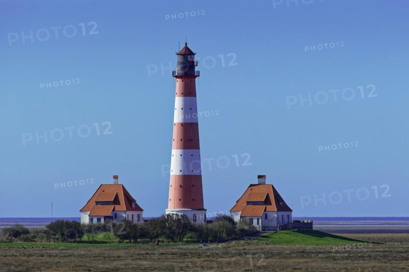 Westerheversand lighthouse on a terp near Westerhever in the Wadden Sea National Park. UNESCO World Heritage Site. Schleswig-Holstein, Germany, Europe