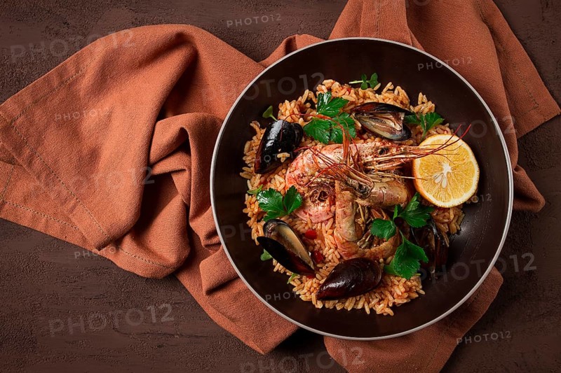Seafood paella, shrimp and mussels risotto, rice, homemade, top view, no people