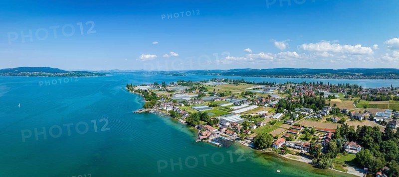Aerial panorama of the western part of Reichenau Island, on the horizon from the left the Höri peninsula, the Hegau mountains, the Mettnau peninsula and the Bodanrück, Constance district, Baden-Württemberg, Germany, Europe
