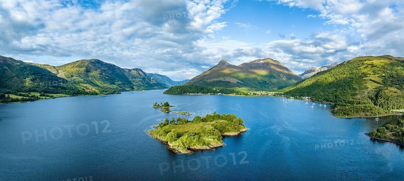 Aerial panorama of the western part of the freshwater loch Loch Leven with the historic island of EileanMunde, above it the 742 metre high Pap of Glencoe, Highlands, Scotland, United Kingdom, Europe