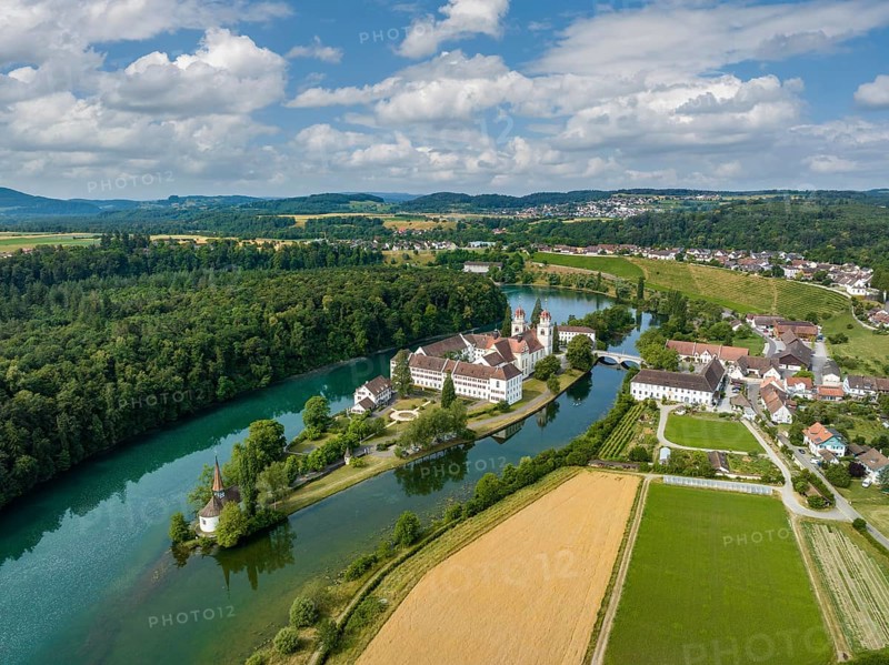 Aerial view of the former Benedictine abbey with the monastery church of St. Mary and the pointed church of St. Magdalena on the Rhine island of Rheinau, Andelfingen, Canton Zurich, Switzerland, Europe