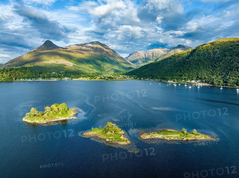 Aerial view of a group of islands in the western part of Loch Leven, far left the history-rich Isle of Discussion, above it the 742-metre-high Pap of Glencoe, Highlands, Scotland, United Kingdom, Europe