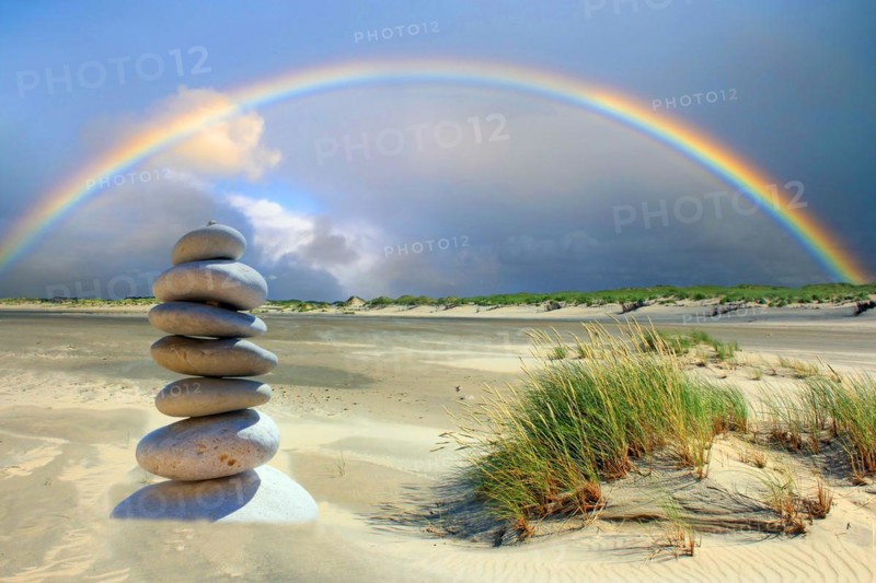 Pebble tower on the beach of the island of Borkum, rainbow, island of Borkum, Lower Saxony, Federal Republic of Germany