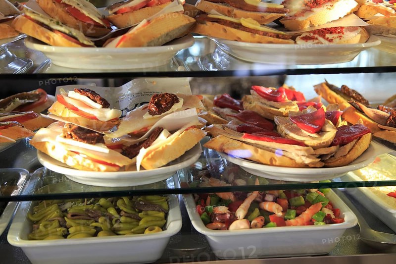 Tapas food display inside famous historic Los Gatos Cervecerias bar, Madrid city centre, Spain, Europe