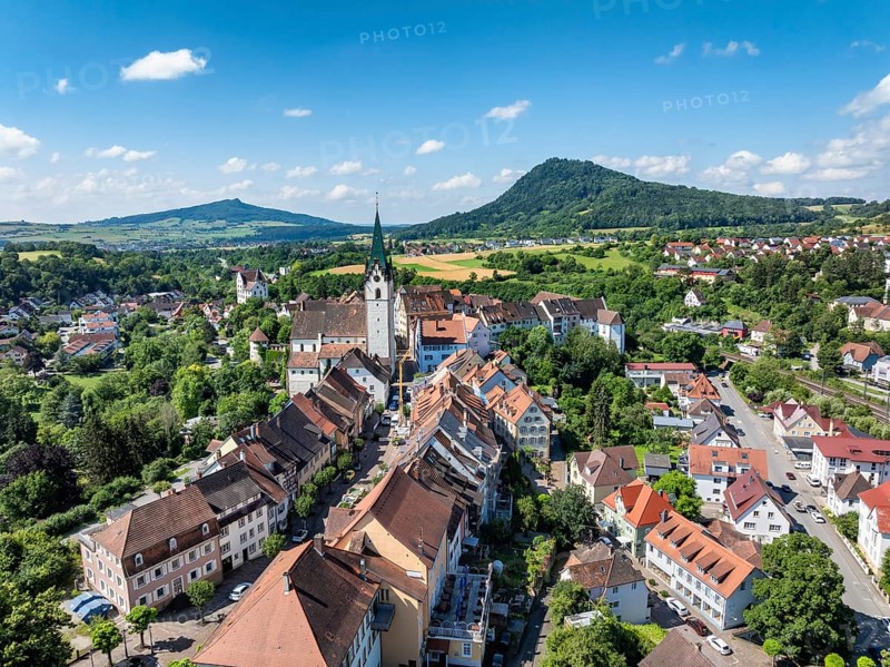 Aerial view of the town of Engen in Hegau with the Church of the Assumption of the Virgin Mary in the old town centre, on the horizon seen from the left the Hohenstoffeln and Hohenhewen mountains, district of Constance, Baden-Württemberg, Germany, Europe