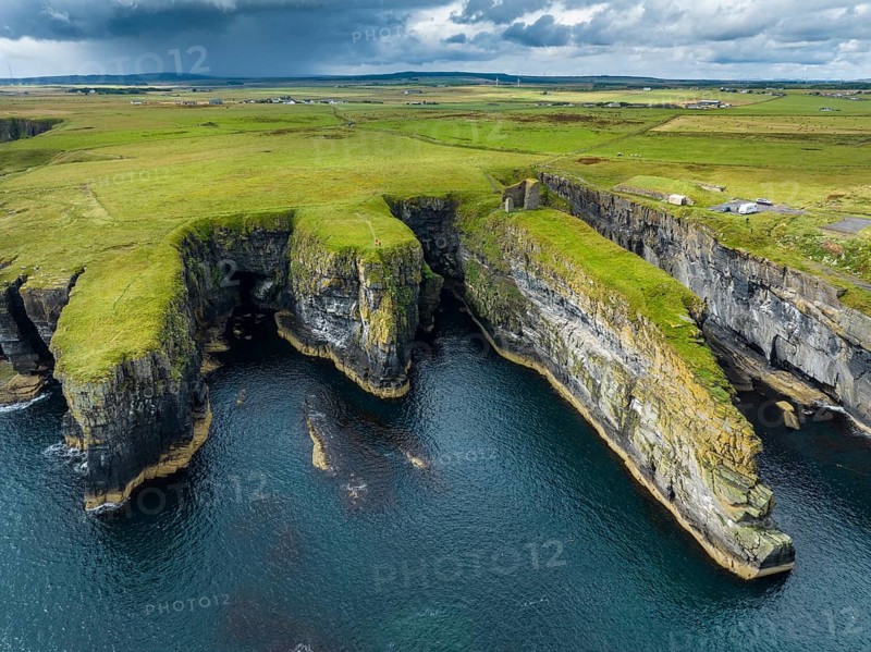 Aerial view of the ruined Castle of Old Wick surrounded by rugged cliffs on the North Sea coast, Wick, County Caithness, Scotland, United Kingdom, Europe