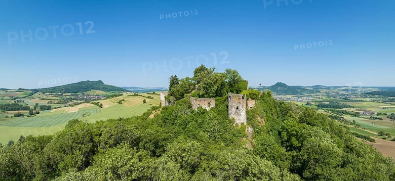 Aerial panorama of the Hegau volcano and the ruins of MÃ¤gdeberg Castle, on the horizon on the left the Hohenstoffeln, on the right the Hohenhewen, Constance County, Baden-Württemberg, Germany, Europe