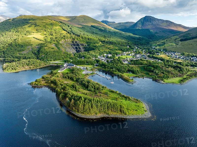 Aerial view of the village of Ballachulish with the harbour and the former slate quarry at the western part of the freshwater loch Loch Leven, Highlands, Scotland, United Kingdom, Europe