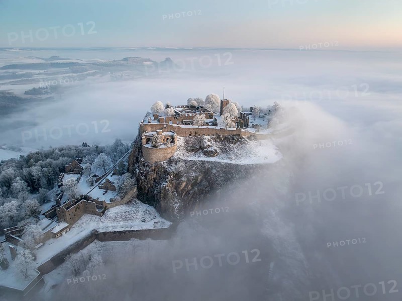 Aerial view of the Hegau volcano Hohentwiel with Germany's largest fortress ruins on a cold, foggy winter morning, in front of sunrise, on the horizon the HohenkrÃ¤hen, Singen am Hohentwiel, district of Constance, Baden-Württemberg, Germany, Europe