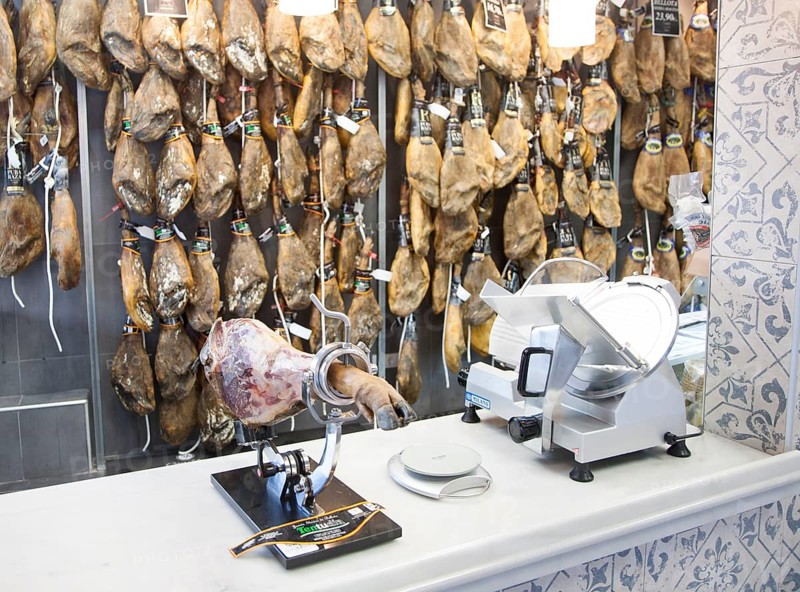 Close up display of cured hams inside a specialist shop in Barrio Macarena, Seville, Spain, Europe