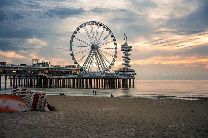 Ferris wheel at sunset on the pier at the beach, The Hague, Netherlands