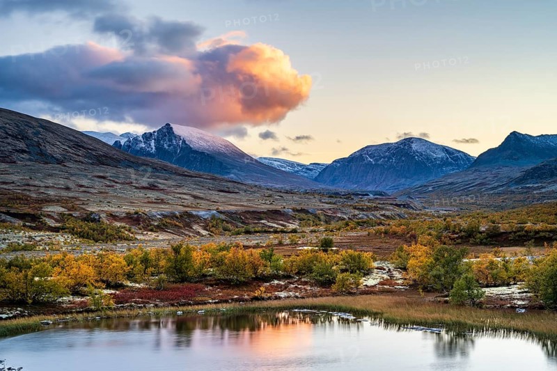 Mountains and lake in autumnal mountain landscape, Rondane National Park, Norway, Europe