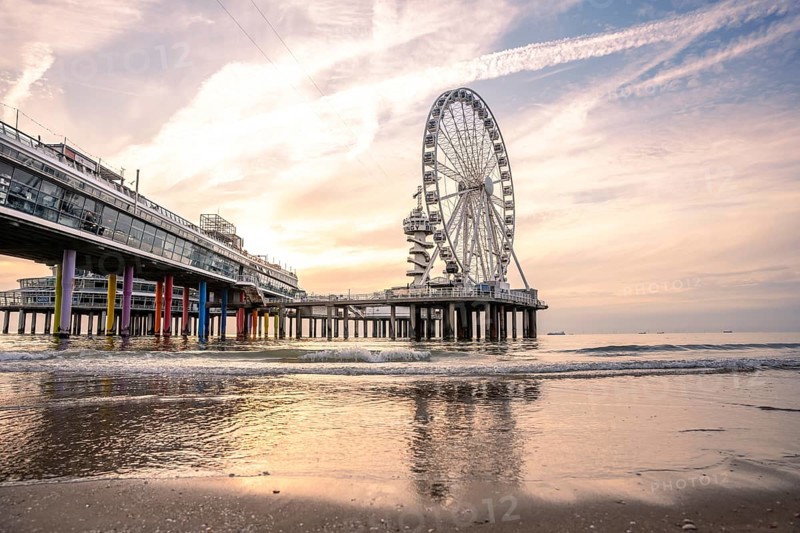 Ferris wheel on the pier on the beach at sunset, The Hague, Netherlands
