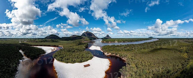 Black river and white sand beach before the granite hills, Cerros de Mavecure, Eastern Colombia