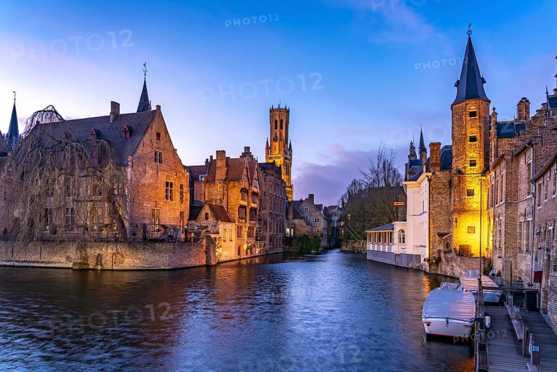 Rozenhoedkaai canal with belfry at dusk, Bruges, Belgium, Europe
