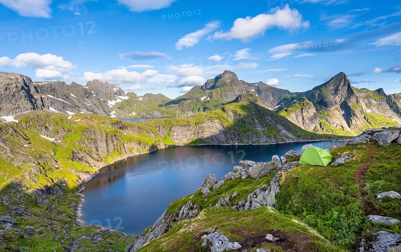 Green camping tent, mountain landscape with lake Tennesvatnet, at sunrise, behind peak of Hermannsdalstinden, Moskenesoya, Lofoten, Nordland, Norway, Europe