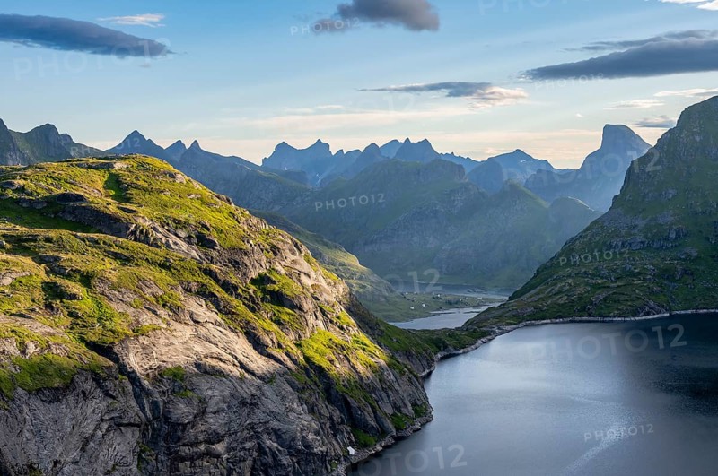 Mountain landscape with lake Tennesvatnet, view of fjord Forsfjorden with village Vindstad, at sunrise, Moskenesoya, Lofoten, Nordland, Norway, Europe