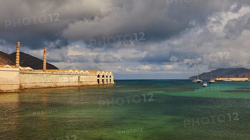 Green sea, Dark clouds, Dramatic light, Tonnara, Old tuna factory, Favignana town, Main town, Favignana, Egadi Islands, Sicily, Italy, Europe