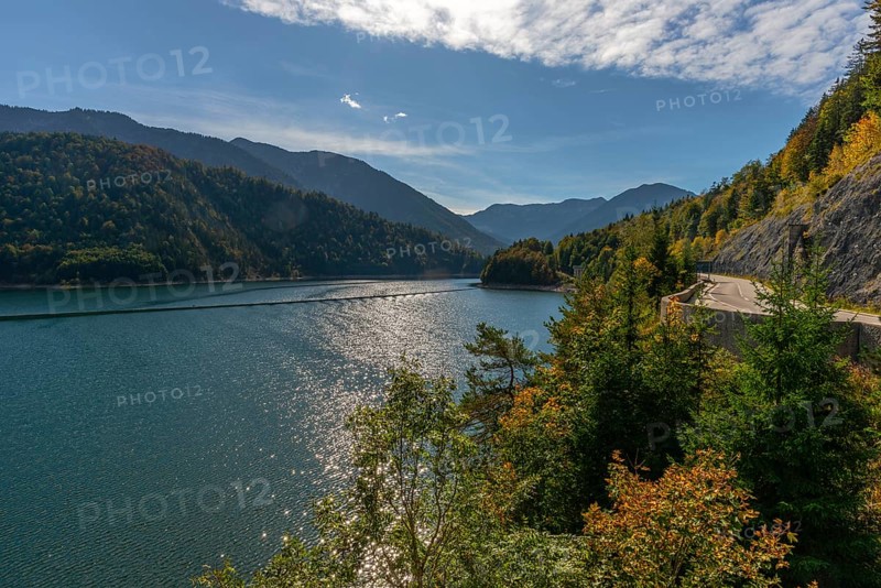 Intake structure at the Sylvenstein reservoir is used for flood protection, dams the Isar, power station, power generation, forest, road, blue sky