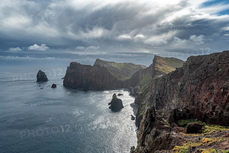 Red cliffs and rocks in the sea, coastal landscape with dramatic sky, Ponta de Sao Lourenço, volcanic peninsula Sao Lourenço, Ponta de San Lorenzo, Madeira, Portugal, Europe
