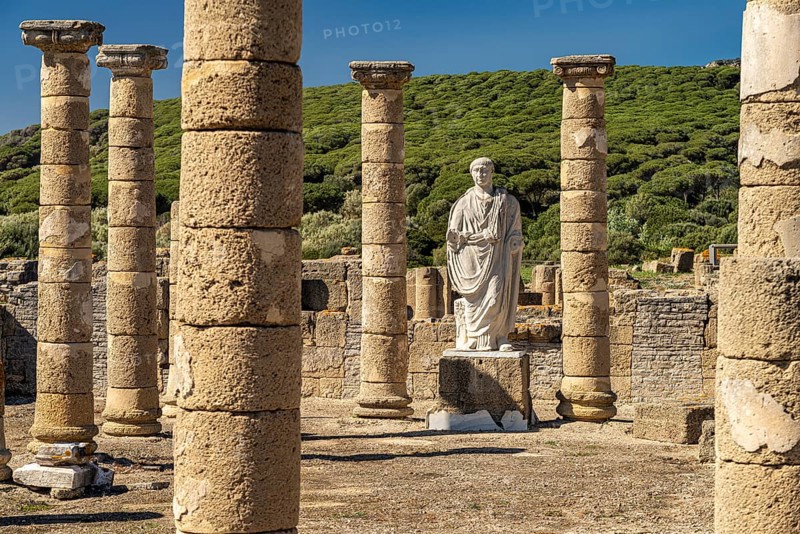 Trajan statue and basilica of the Roman ruins of Baelo Claudia in Bolonia, Tarifa, Costa de la Luz, Andalucia, Spain, Europe