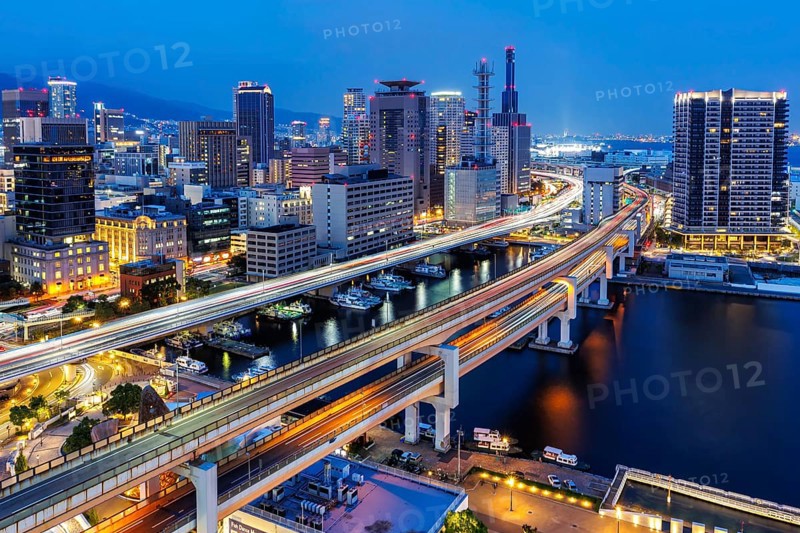 Kobe skyline from above with harbour and elevated roads at night in Kobe, Japan, Asia