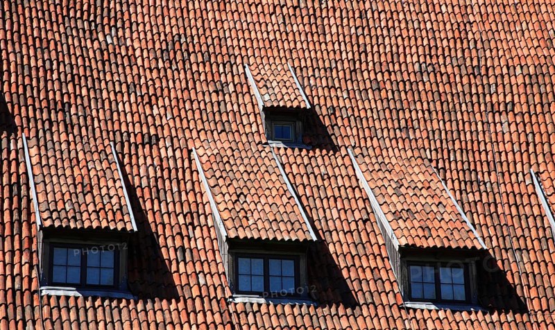 Tiled roof with four dormer windows, attic flat