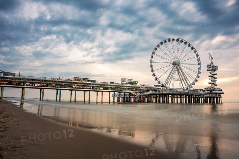 Ferris wheel at sunset on the pier at the beach, The Hague, Netherlands