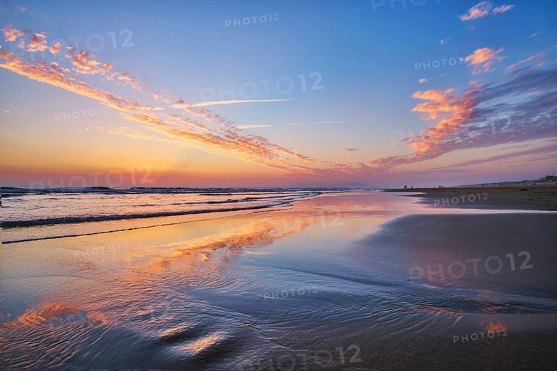 Atlantic ocean after sunset with surging waves at Fonte da Telha beach, Costa da Caparica, Portugal, Europe