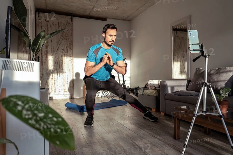Latino man making a fitness video for social media. Content creator or male influencer for online fitness training