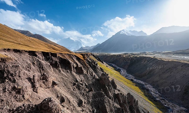 Valley with river Achik Tash between high mountains, mountain landscape with glaciated peak Pik Lenin, Trans Alay Mountains, Pamir Mountains, Osh Province, Kyrgyzstan, Asia