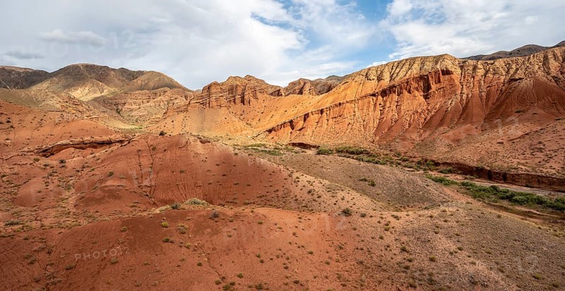Eroded mountain landscape with sandstone cliffs, red and orange rock formations, Konorchek Canyon, Chuy, Kyrgyzstan, Asia