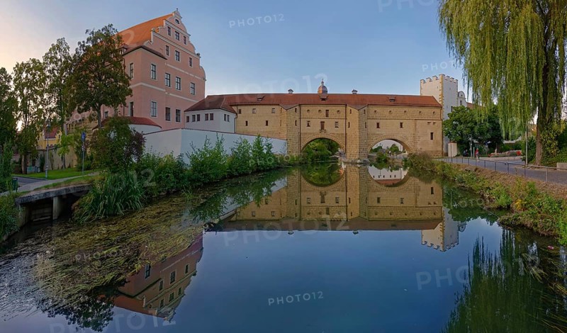 An old fortification wall town spectacle is perfectly reflected in the calm waters of the river Vils, Amberg, Upper Palatinate, Bavaria, Germany, Europe