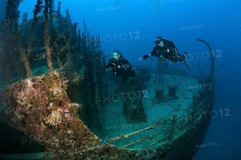 Divers at the stern of the Maldive Victory wreck, Hulhule, North Male Atoll, Maldives, Asia