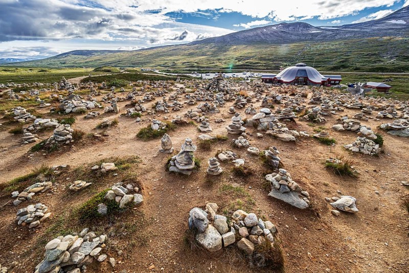 Polar center (Polarsirkelsenteret) at the Arctic Circle at road E6, 66.33 degree north, Saltfjell, hundreds of cairns build by tourists, Nordland, Norway, Europe