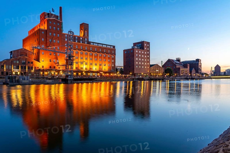 The inner harbour, in Duisburg, Werhahn-Mühle building on the left, granary with Explorado Children's Museum, Faktorei 21 building on the right, North Rhine-Westphalia, Germany, Europe