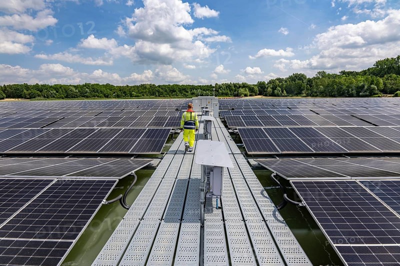 Germany's largest floating solar power plant on the Silbersee III, a quarry pond no longer used for sand mining, near Haltern am See, operated by Quarzwerke GmbH, around 5800 solar modules, on an area of a good 2 football pitches, generate 3.1 megawatts of power, the company uses the electricity itself on weekdays, at weekends it flows into the public grid, North Rhine-Westphalia, Germany, Europe