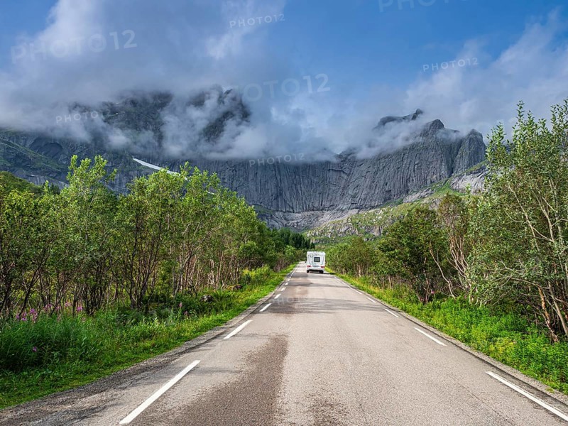 Steep granite cliffs at the road to Nusfjord, narrow single track road, Nusfjord, Flakstadoy, Lofoten, Norway, Europe