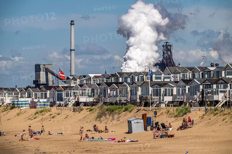 The Tata Steel steel and smelting works in IJmuiden, Velsen, North Holland, Netherlands, largest industrial area in the Netherlands, 2 blast furnaces, 2 coking plants, rolling mills, directly on the North Sea, beach houses near Ijmuiden aan Zee