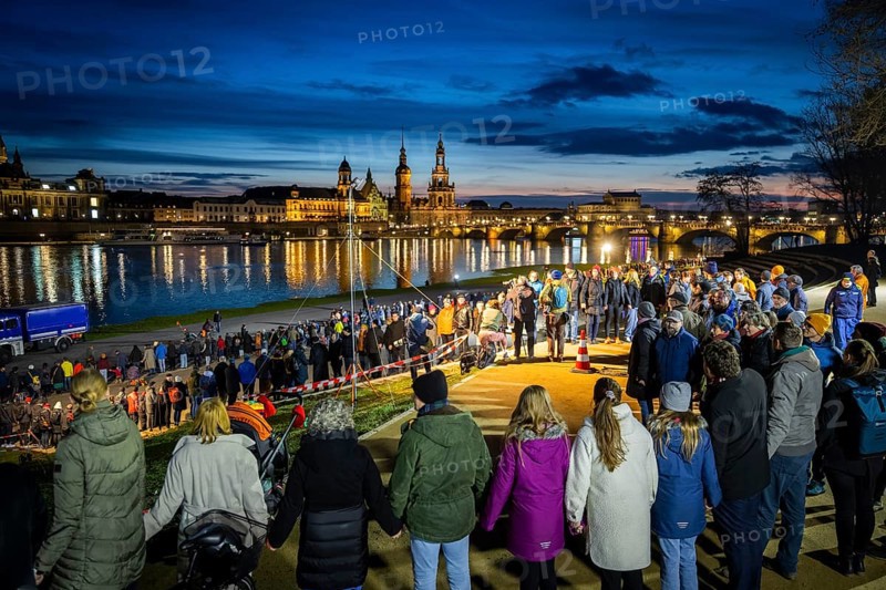 On 13 and 14 February 1945, Dresden was heavily destroyed in three Allied bombing raids. Every year, the people of Dresden commemorate this event at various events. A long human chain symbolised the protection of the city centre. Here looking from the Königsufer across the Elbe to the Old Town, Dresden, Saxony, Germany, Europe