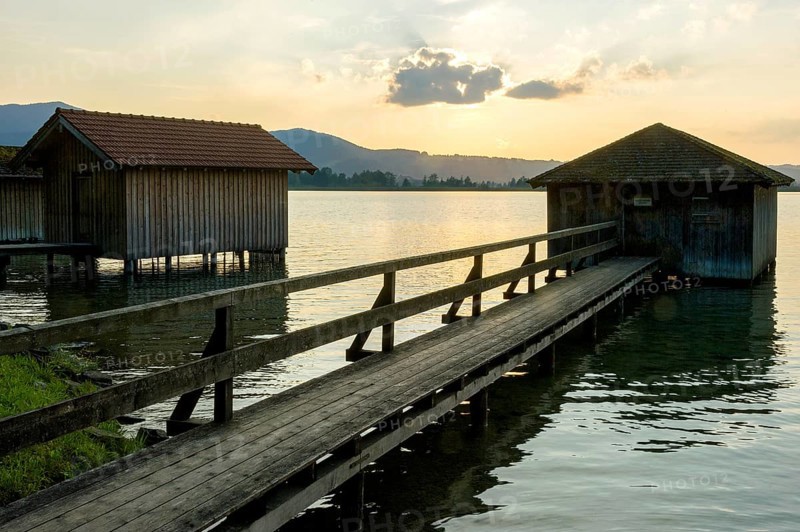 Boat huts with wooden jetty, sunset at Lake Kochel near Kochel am See, Bavarian Alpine foothills, Alps, Upper Bavaria, Bavaria, Germany, Europe