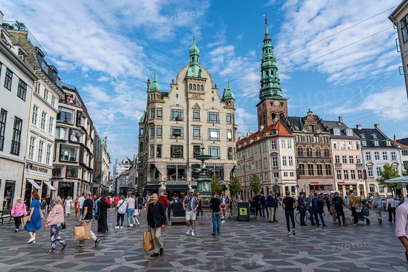Old town, city centre, Amagertorv, part of the pedestrian zone Stroget, gastronomy, shops, Copenhagen, tower of Nikolaj Kunsthal, former church, now art exhibition hall, Denmark, Europe