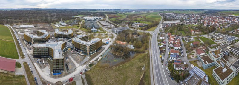 IBM construction project in Ehningen, aerial view. Large construction site Technology Campus. Once the buildings are completed, the new German headquarters will provide space for 3500 employees. In the background the current IBM site, which is to be developed into the Quantum Gardens project, on the right the municipality of Ehningen, Böblingen district, Baden-Württemberg, Germany, Europe